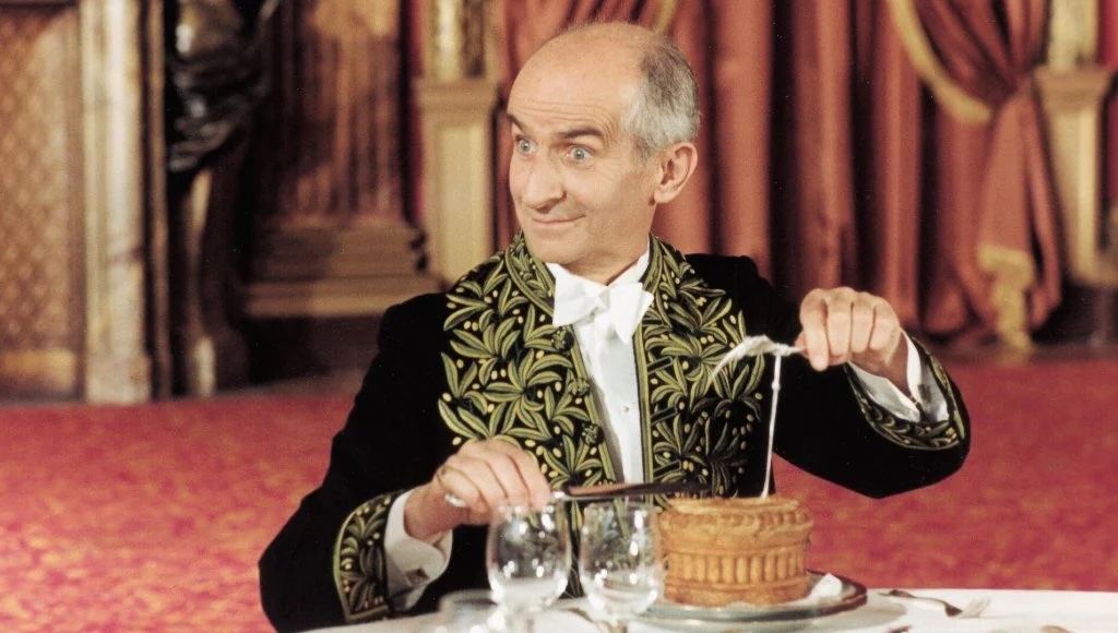 Image tirée du film L'aile ou la cuisse, où Louis de Funes incarne le propriétaire d'un guide gastronomique